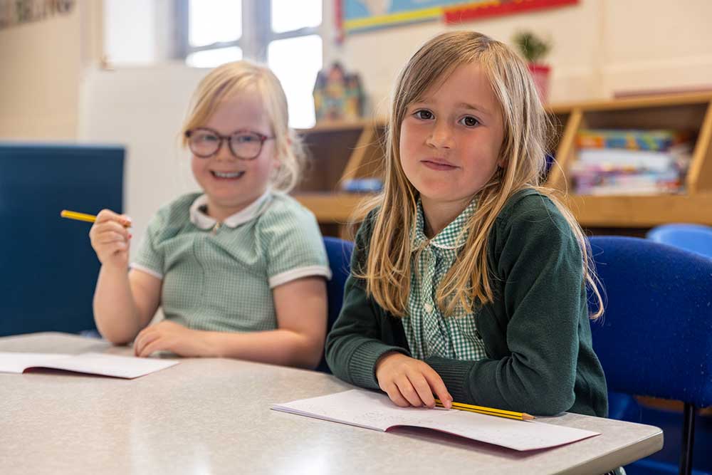 Lostwithiel Ofsted Report Image Girls Learning Girls learning in a classroom at Lostwithiel Primary School